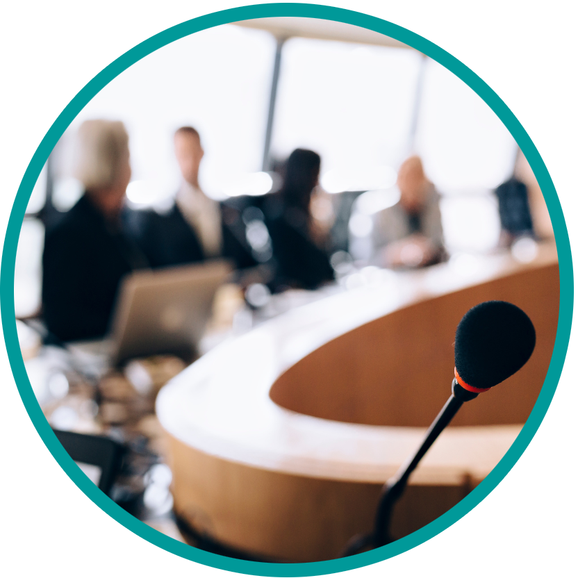 Blurry board room with microphone and people sitting