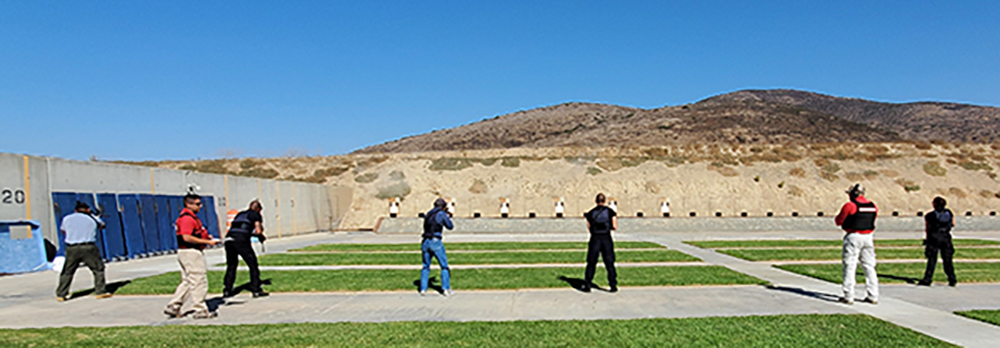 Chief Aguirre with three members of the Firearms training unit